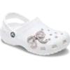 Bijoux Jibbitz™ « Nœud rose pailleté »